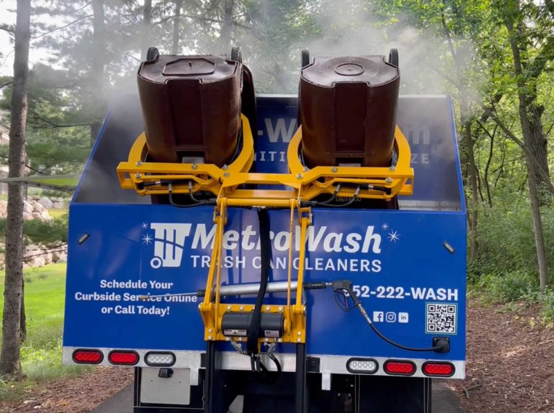 Garbage and recycling bins being cleaned by MetroWash.